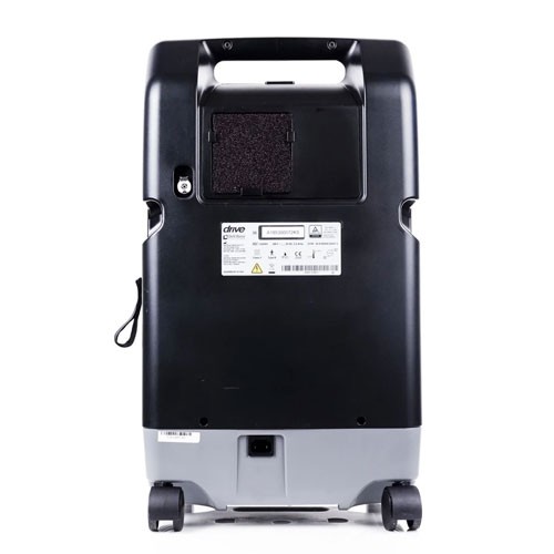 DeVilbiss 10 LPM oxygen concentrator — rear view showing the cabinet air filter and rating label