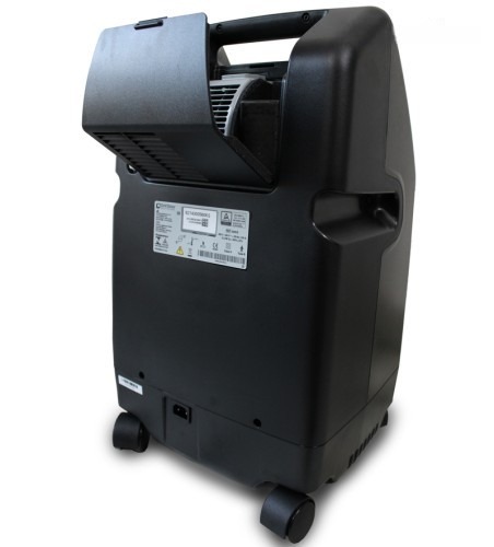 DeVilbiss 5 LPM oxygen concentrator — rear view with the cabinet filter cover open