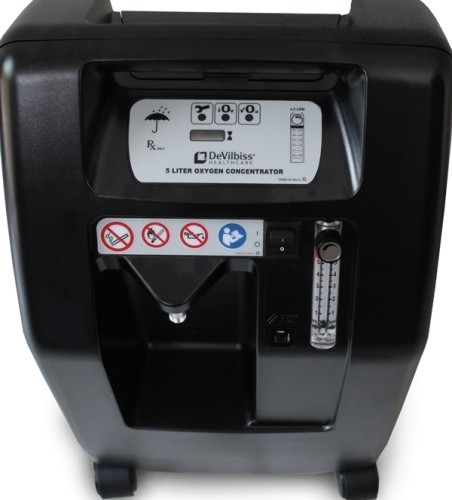 DeVilbiss 5 litre oxygen concentrator control panel — flow meter, power switch and safety labels